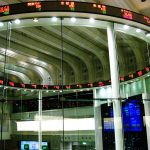multiple trading screens showing live financial data