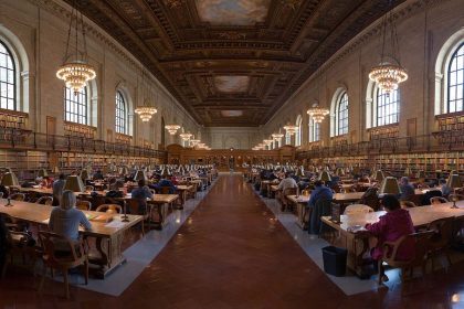 people reading quietly in a public library