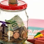 piggy bank surrounded by coins